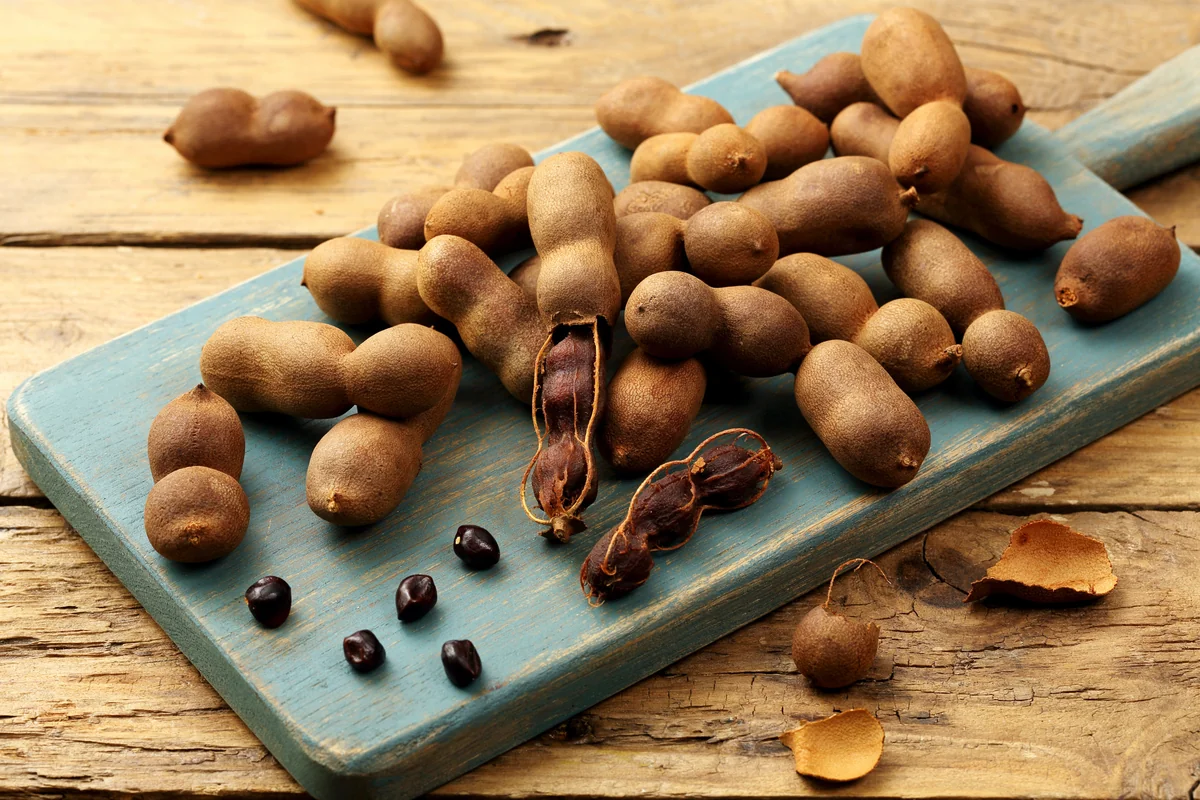 Whole tamarind pods, the fruit used to make agua de tamarindo