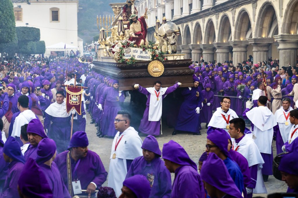 Float with Christ and the cross carried by cucuruchos at the procession San Bartolome de Becerra at the Parque Central in Antigua Guatemala. (Depositphotos)