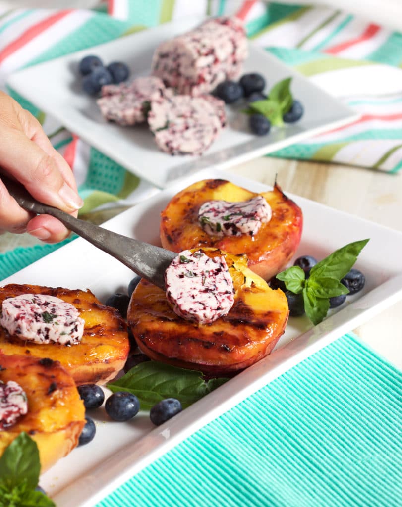 Grilled peaches with blueberry basil butter