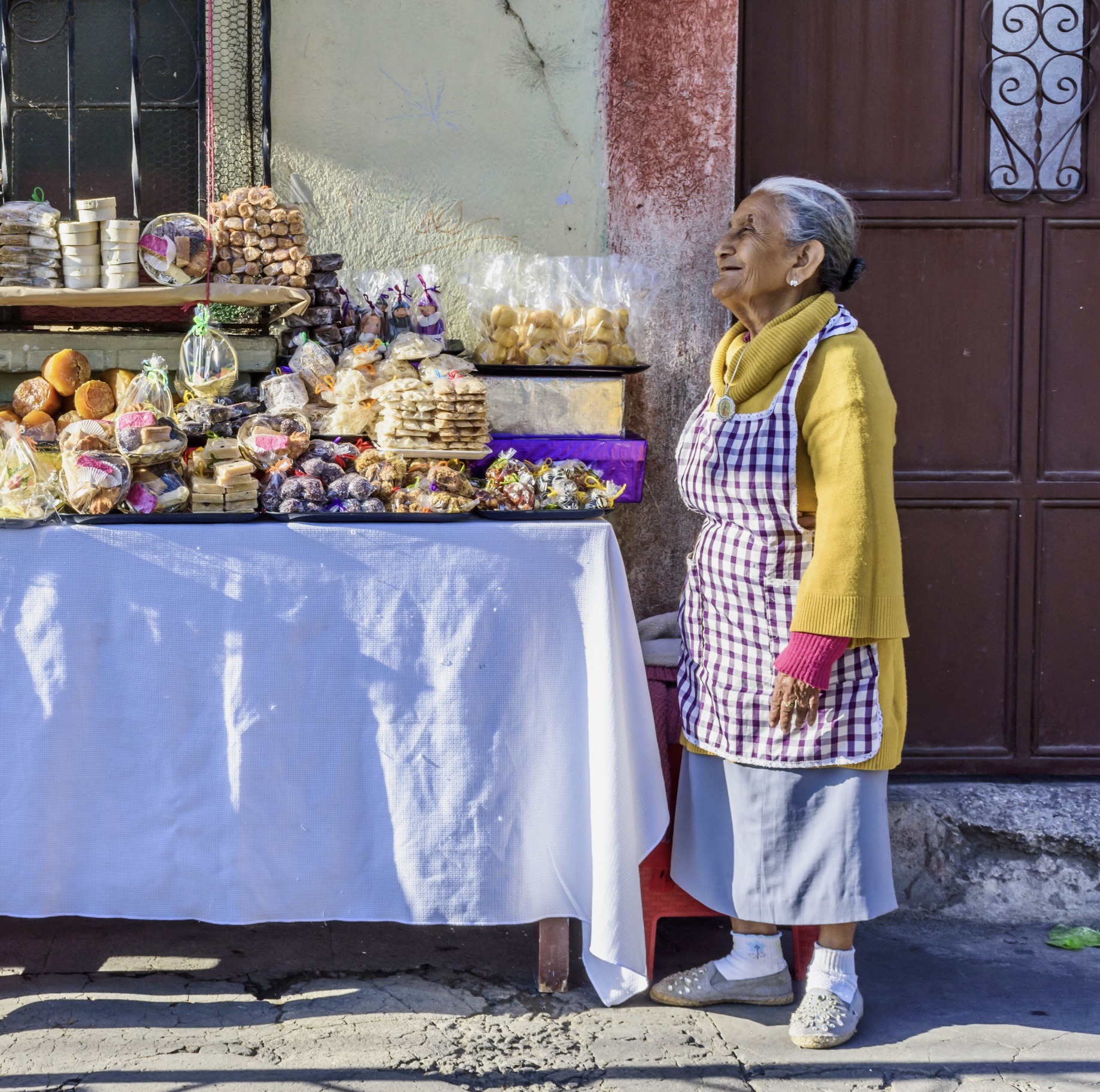 woman selling traditional Guatemalan candy during Holy Week in Guatemala