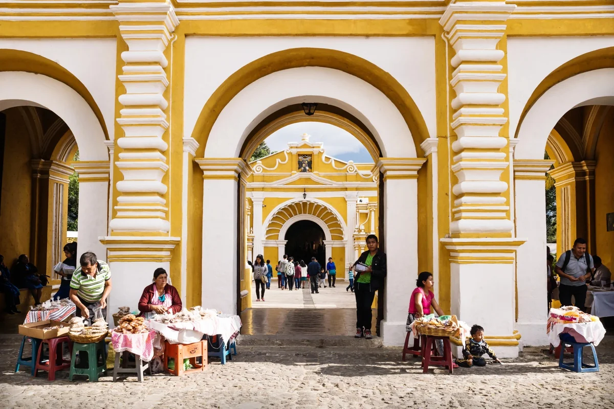 Arched market hall with food stalls and comedores in Antigua Guatemala