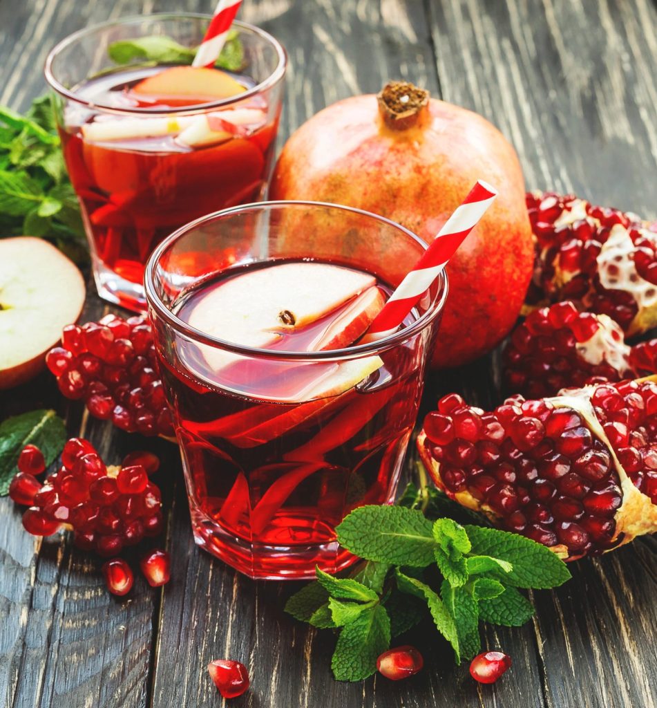 Pomegranate apple sangria recipe made with red wine, fresh apple slices, and pomegranate juice, a festive Christmas sangria and winter cocktail perfect for holiday entertaining