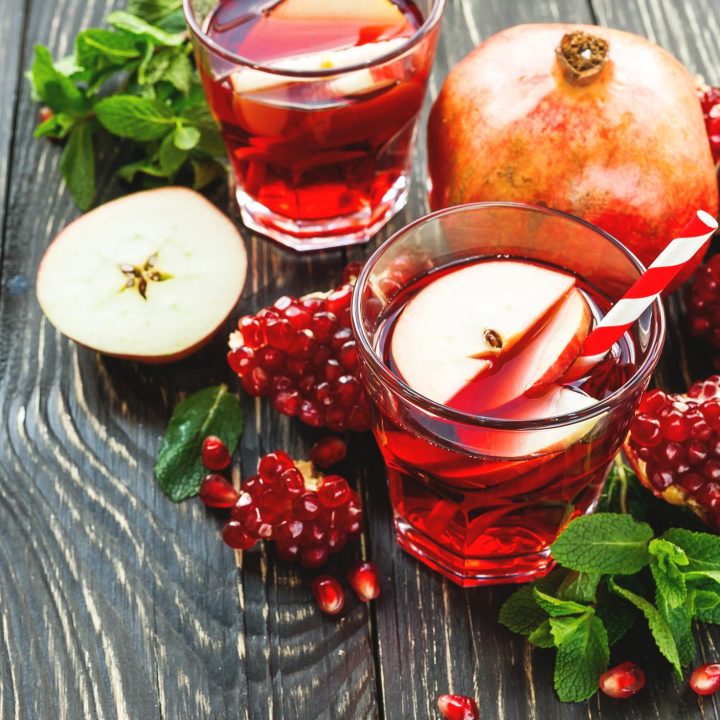 Holiday pomegranate apple sangria with red wine and fresh fruit, a colorful Christmas cocktail and winter sangria recipe for parties