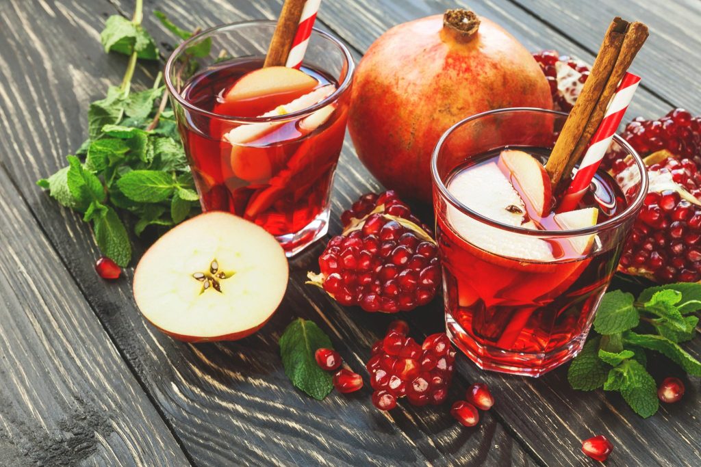 Christmas sangria with pomegranate juice, red wine, and apples, a simple pomegranate cocktail and winter sangria recipe for holiday entertaining