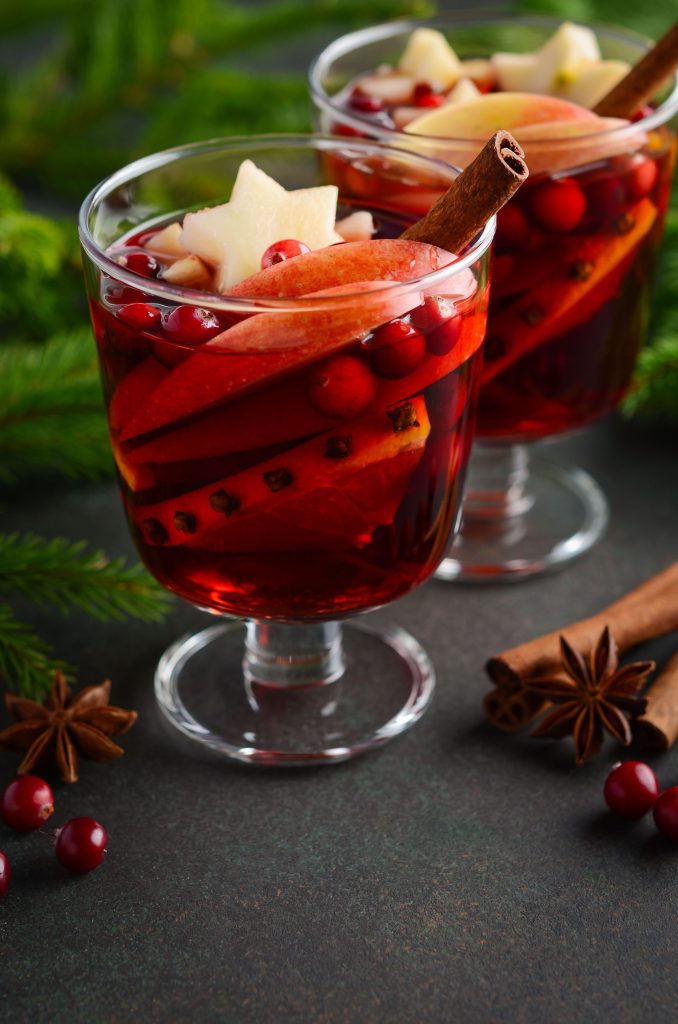 Classic mulled wine Christmas cocktail recipe garnished with cinnamon and citrus