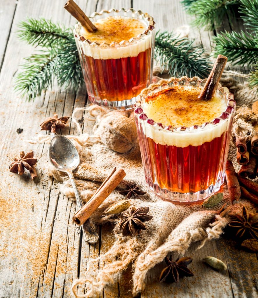 A cozy hot buttered rum cocktail served warm with butter foam, dark rum, and spices. This classic winter drink is ideal for holiday entertaining and chilly evenings.
