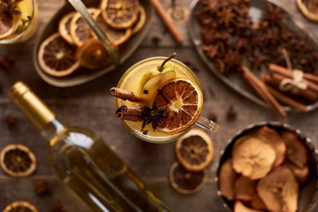 Pear mulled white wine with cinnamon sticks and dried orange slice