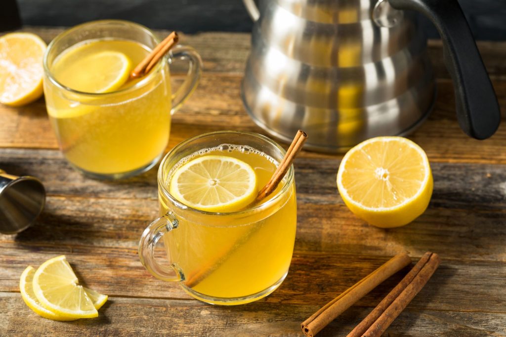 A classic lemon hot toddy made with whiskey, honey, and fresh lemon, perfect as a warm winter cocktail recipe.