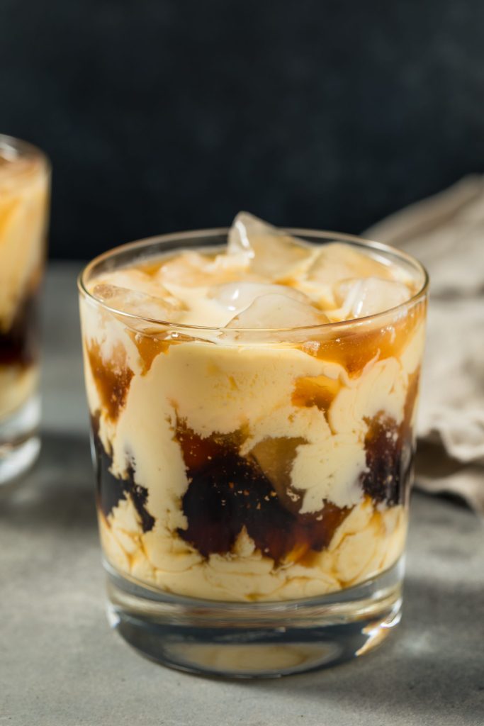 Creamy eggnog White Russian cocktail with coffee liqueur and ice, an easy winter and Christmas cocktail recipe