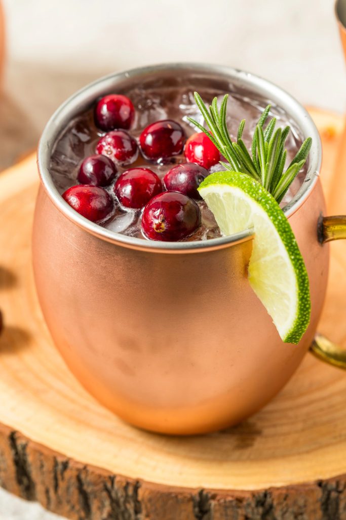 Winter cranberry Moscow mule recipe featuring vodka, ginger beer, lime, and fresh cranberries. This easy holiday mule is bright, bubbly, and great for seasonal entertaining.