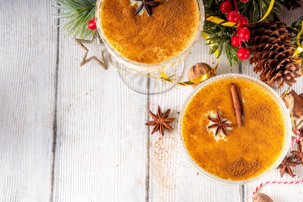 Top view of eggnog martinis dusted with cinnamon and garnished with star anise