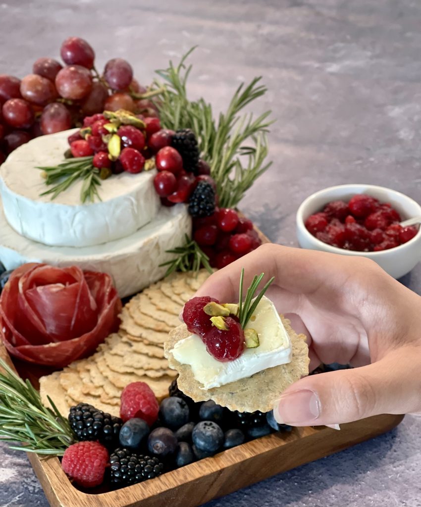 This cranberry pistachio brie cake is the perfect cheese centerpiece for a holiday grazing board. Made with stacked brie wheels and simple seasonal toppings, it’s an easy brie cake idea that always gets compliments.