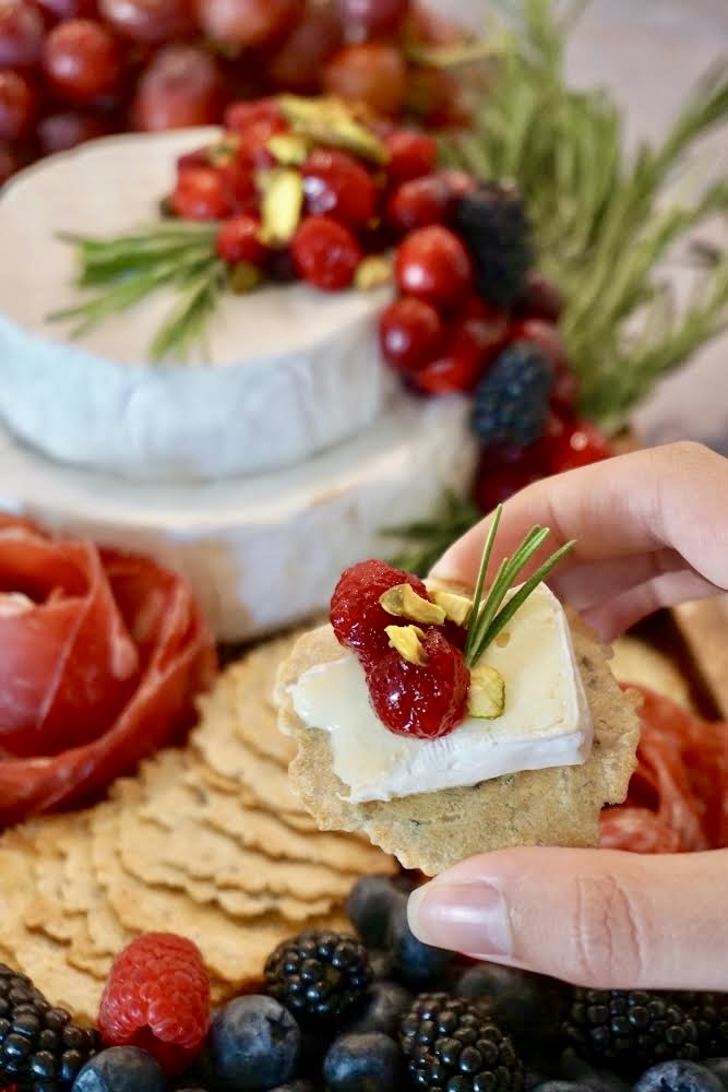 Every bite from this cranberry brie cake grazing board is creamy, festive, and perfect for holiday entertaining. This brie cake is easy to make and ideal for Christmas charcuterie boards and holiday grazing spreads.