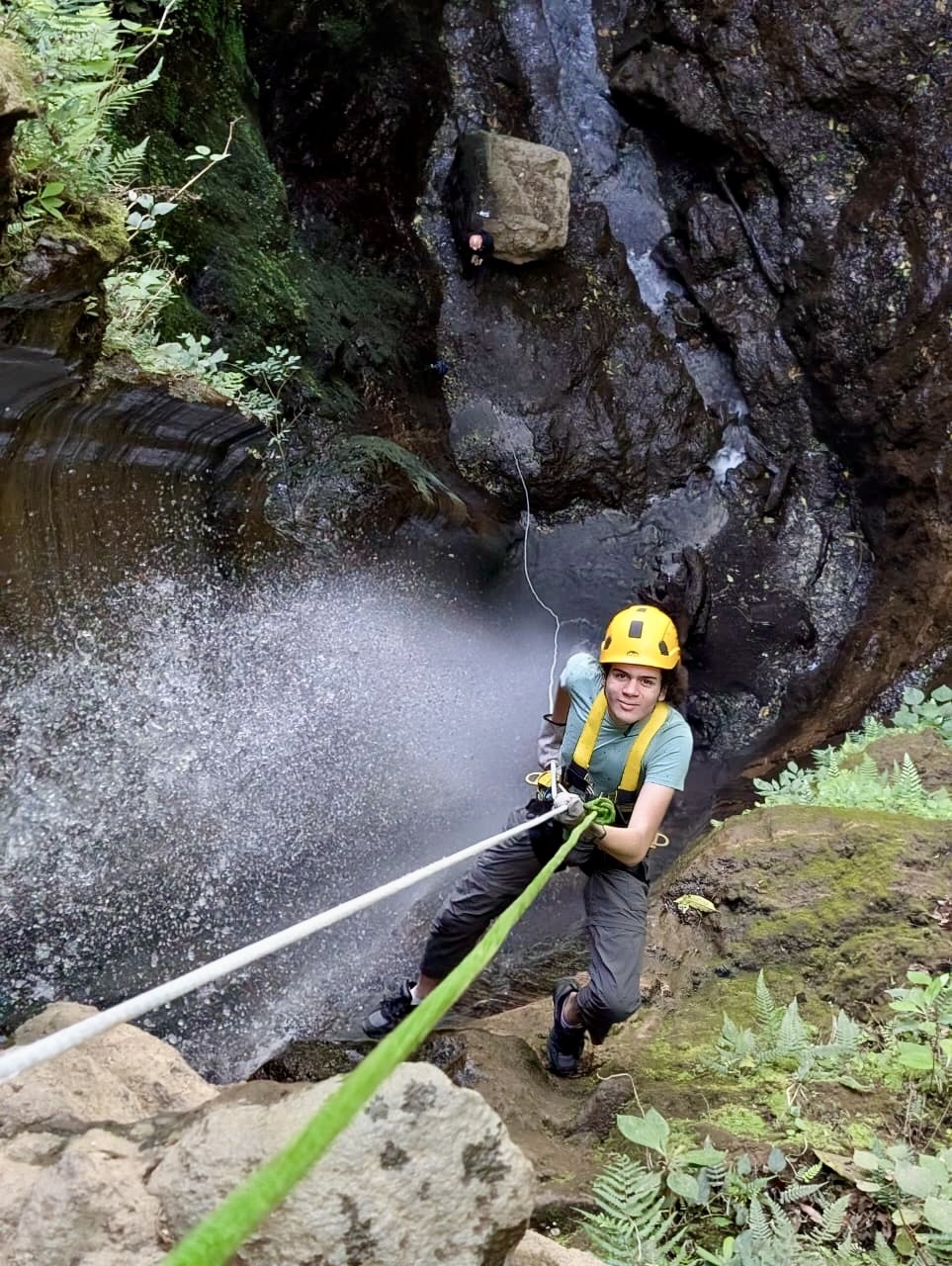 Rappelling down a waterfall at Finca El Barretal in Guatemala