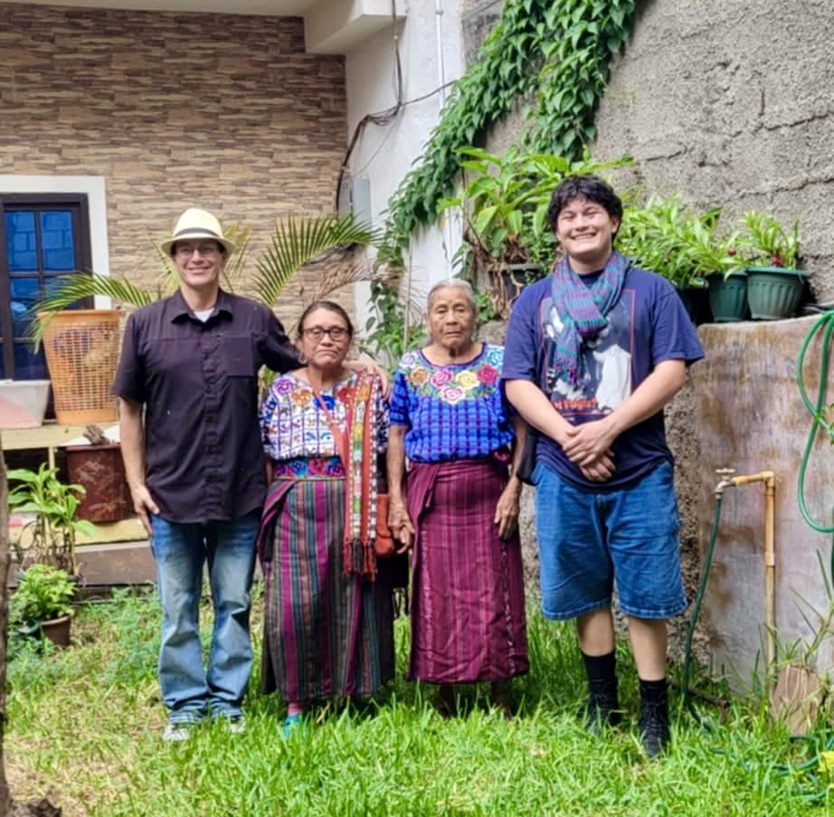 Mayan elders Dolores and Gregoria with visitors before an authentic temazcal ceremony in Guatemala