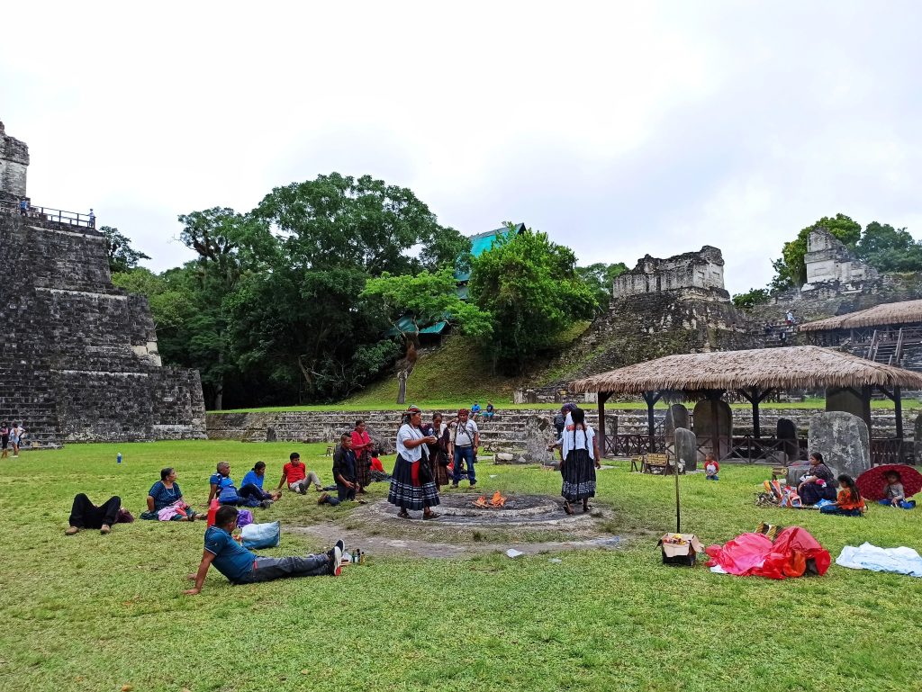Traditional Mayan ceremony taking place near the ruins of Tikal National Park in Guatemala