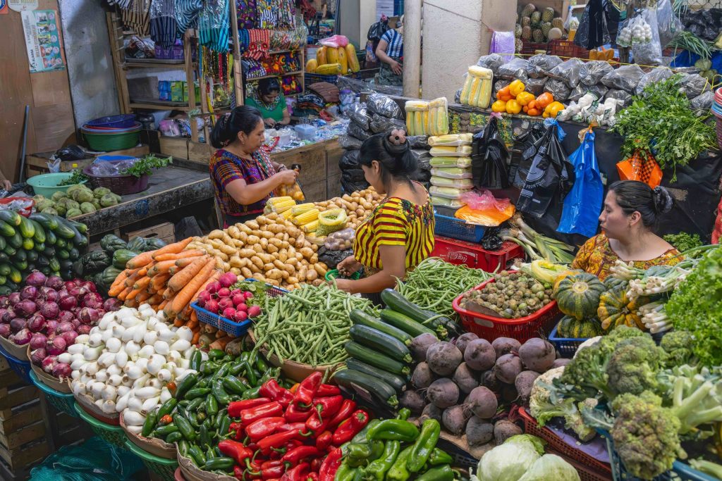 The vibrant local market in Santiago Atitlán, Guatemala, filled with fresh produce, traditional textiles, and everyday life in this authentic Lake Atitlán town.