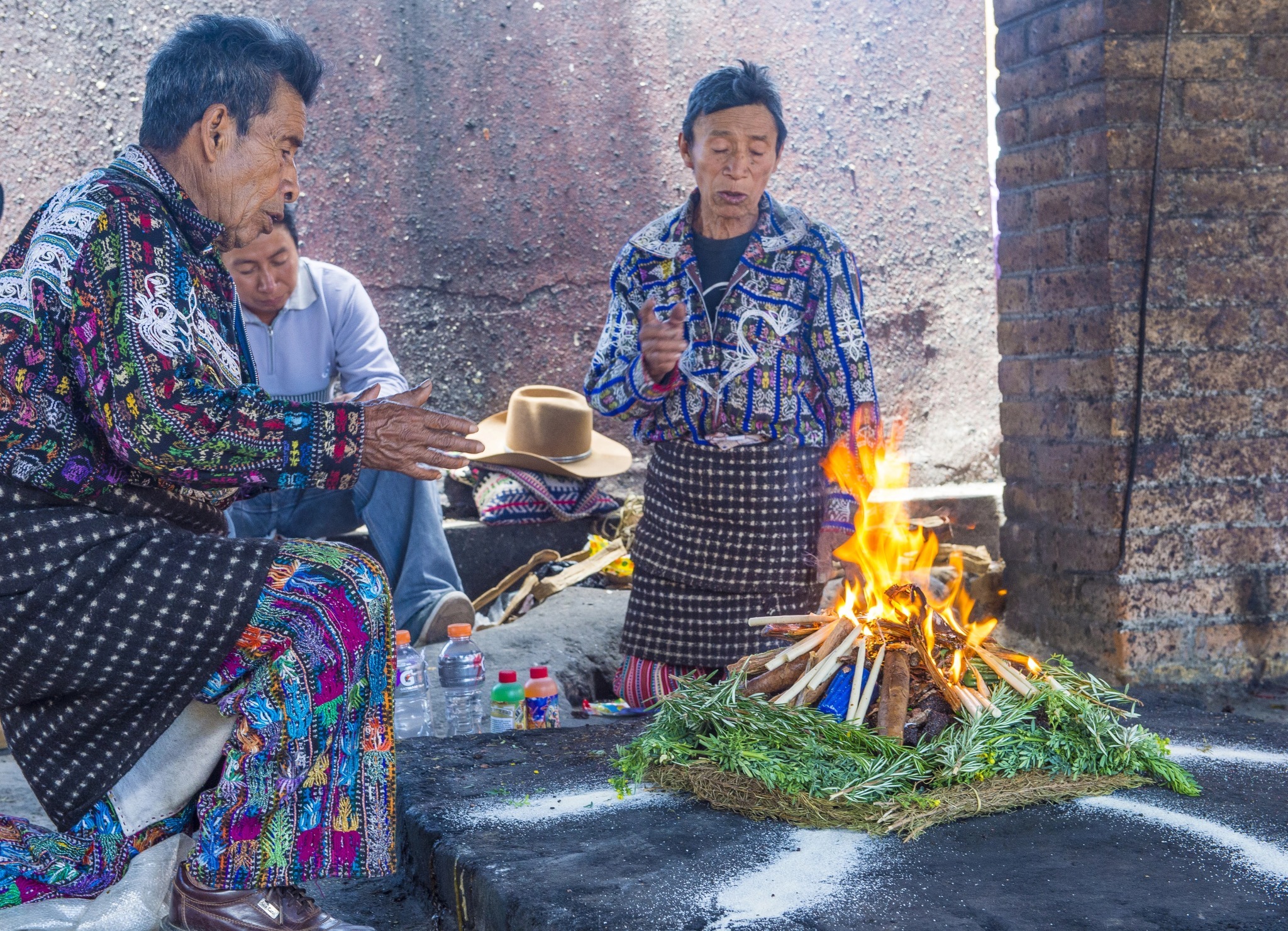 Ceremony in Chichicastenango Guatemala Indigenous Mayan elders praying beside a sacred fire altar in Chichicastenango Guatemala