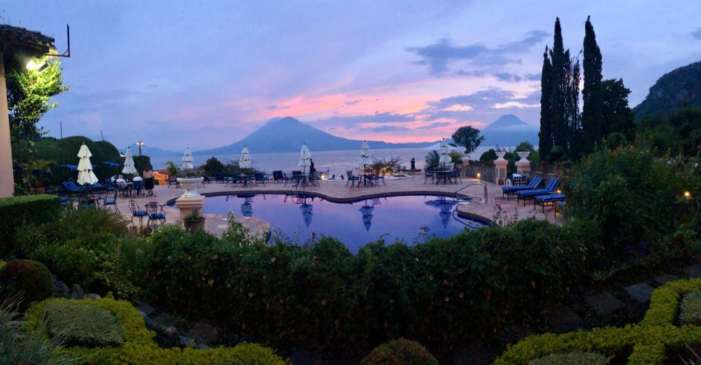 Sunset view from the pool at Hotel Atitlán in Panajachel overlooking Lake Atitlán and volcanoes