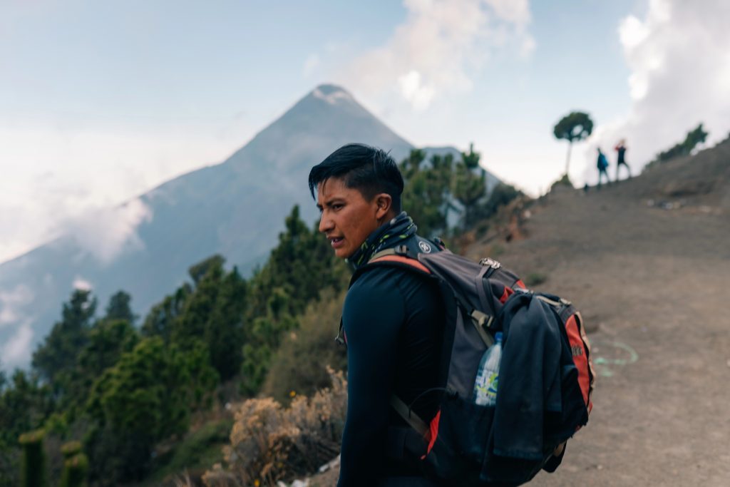 Local Guatemalan guide leading a hiker on the Acatenango volcano trail