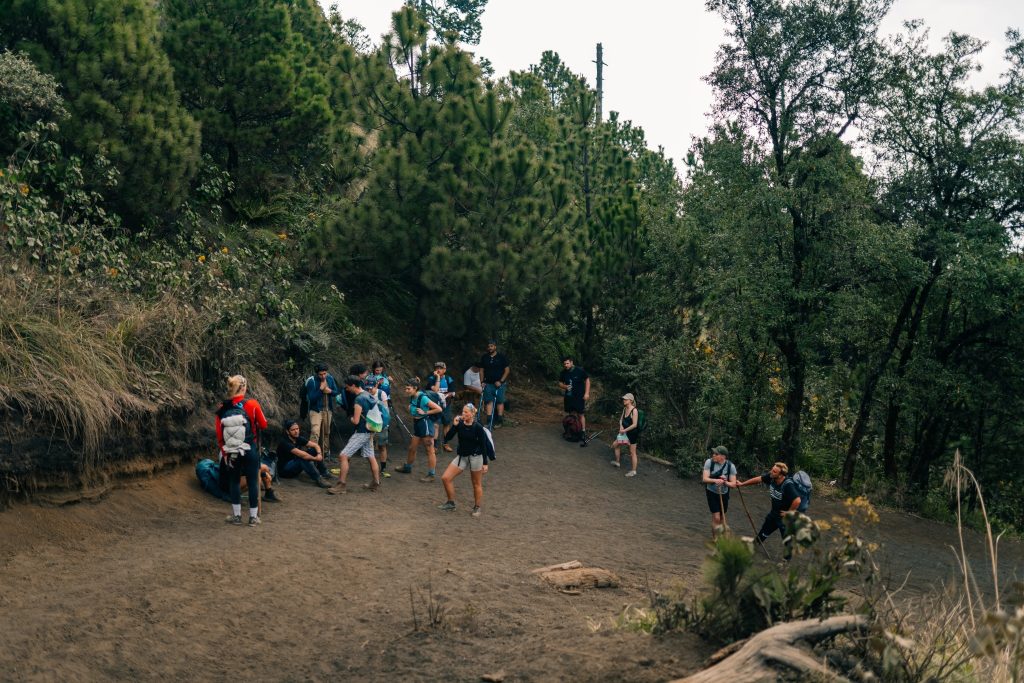 Hikers taking a rest break in the cloud forest section of the Acatenango volcano trail