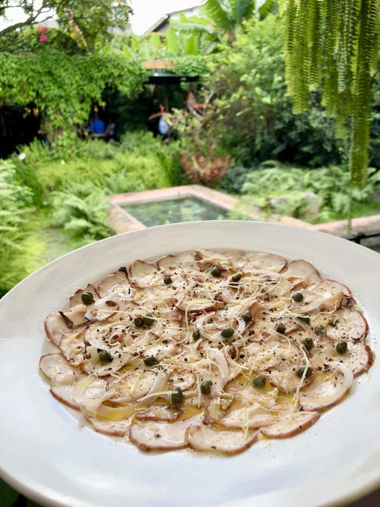 Gluten-free octopus carpaccio with capers and shaved cheese at Epicure Antigua Guatemala