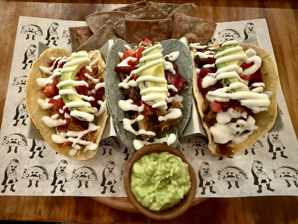 Gluten-free tacos with pulled meat, avocado, pico de gallo, and crema at Tacorazon Antigua Guatemala