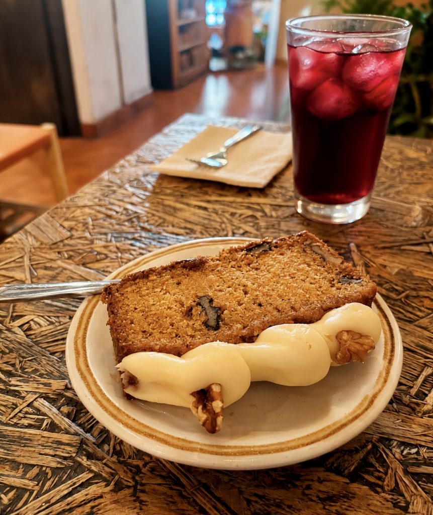 Gluten-free carrot cake slice with walnut and cream cheese frosting at Del Otro Lado Antigua Guatemala