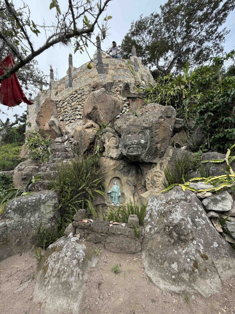 What you really see at Chuitinamit archaeological site near Santiago Atitlán, where carved stones are displayed alongside newer Christian imagery