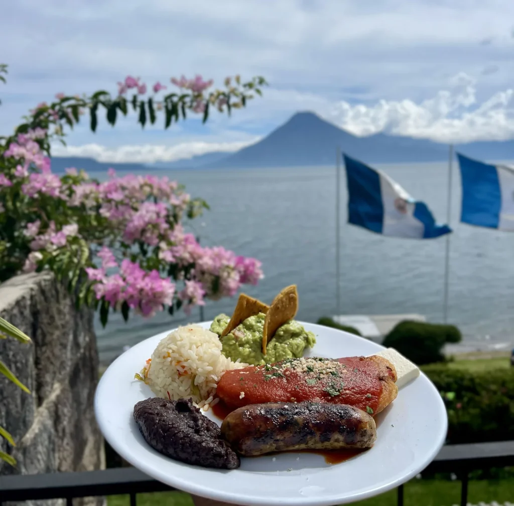 Guatemalan chile relleno with rice and traditional accompaniments at Posada de Don Rodrigo in Panajachel