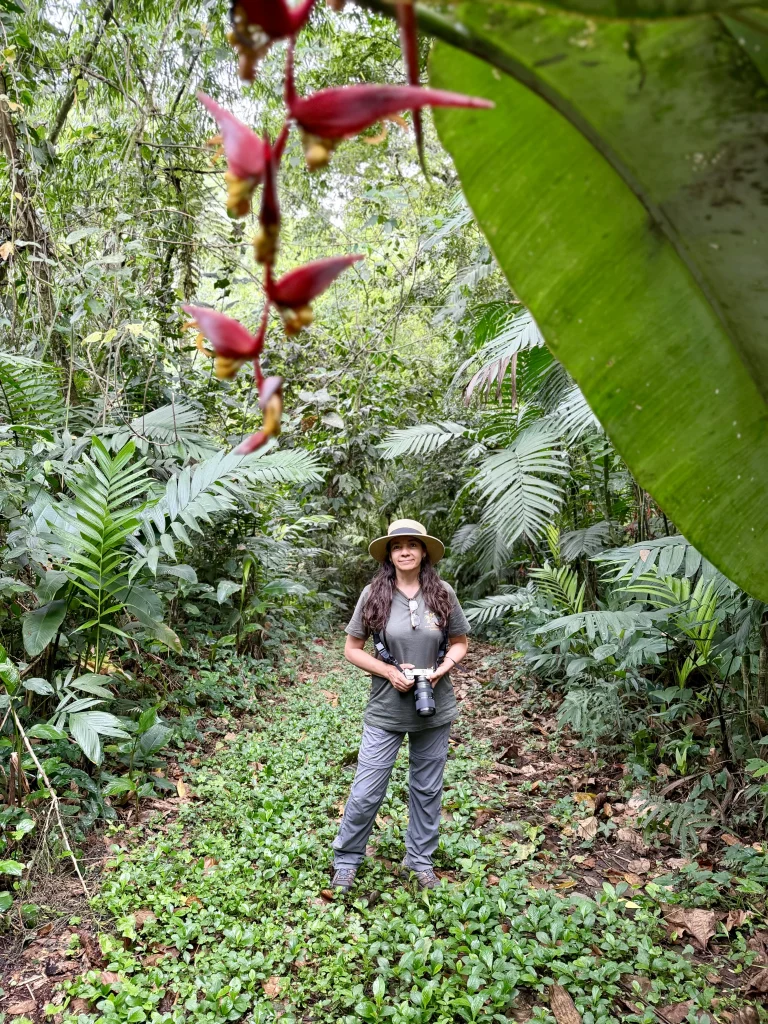Birdwatcher with camera exploring a tropical forest trail at Reserva Patrocinio, a birding lodge and nature reserve in Guatemala