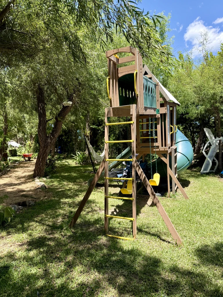 Children's playground in the gardens at Principito's Universe family-friendly Lake Atitlán accommodation near San Juan La Laguna