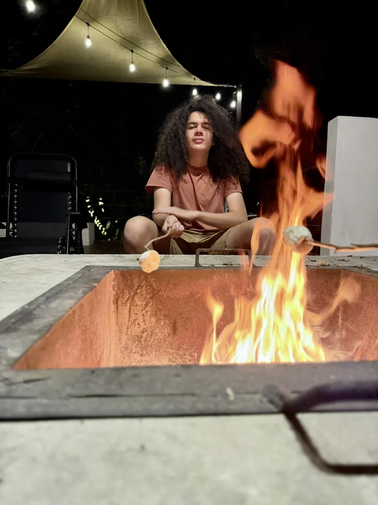 Roasting marshmallows around the private fire pit at Principito's Universe family vacation rental on Lake Atitlán