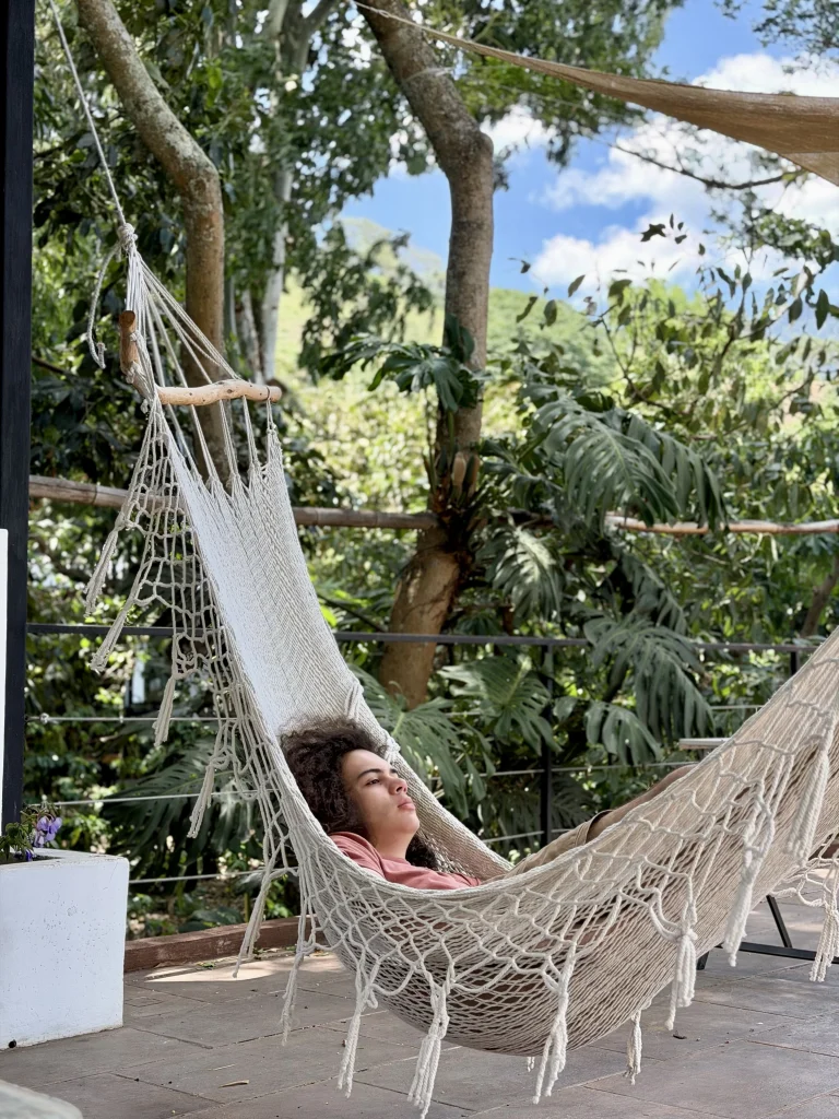 Relaxing in a hammock on the private terrace at Las Baobas Principito's Universe Lake Atitlán vacation rental