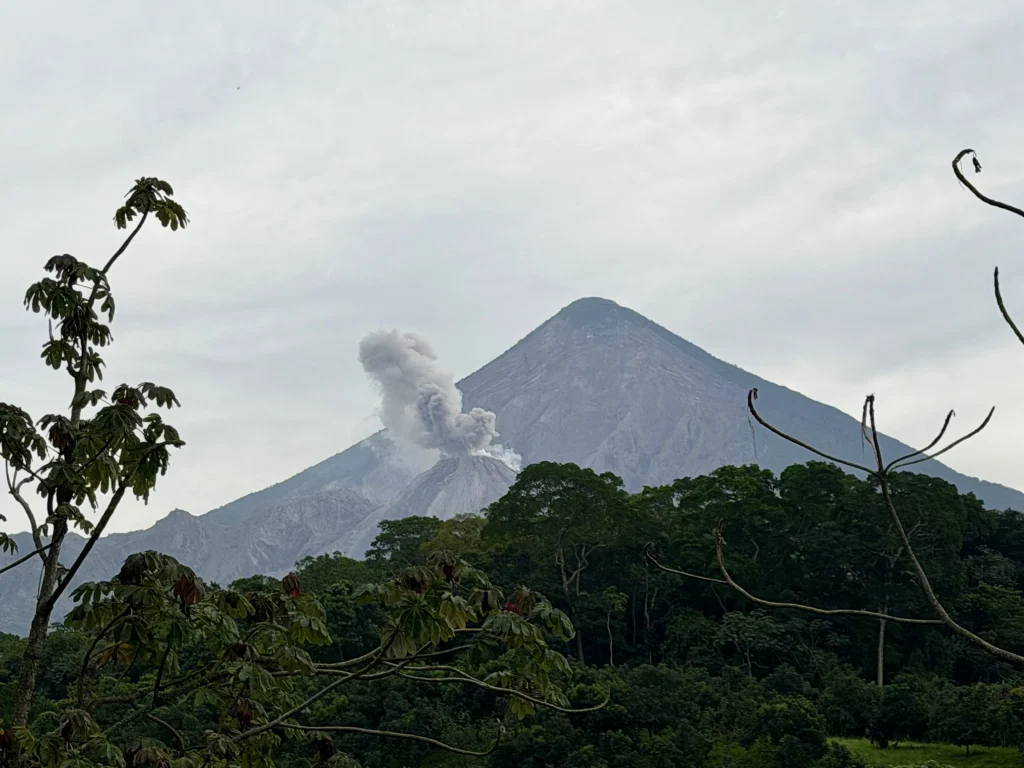 Santiaguito Volcano erupting beneath Santa María Volcano as seen from Reserva Patrocinio in Guatemala