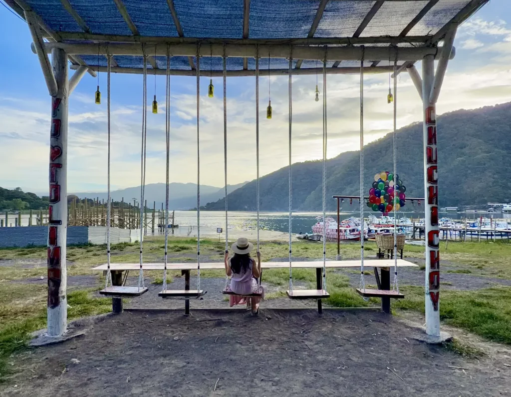 Colorful waterfront swings overlooking Lake Atitlán in San Lucas Tolimán Guatemala